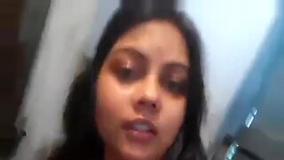 Indian beauty teases with her big tits during a Wapp video call.