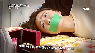 Korean beauty bound and gagged in intense BDSM home invasion.