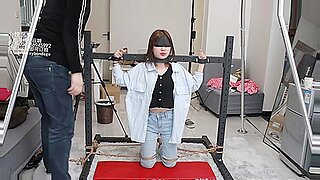 Asian beauty bound and dominated in BDSM play