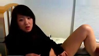 Sultry Asian beauty indulges in solo pleasure on camera.